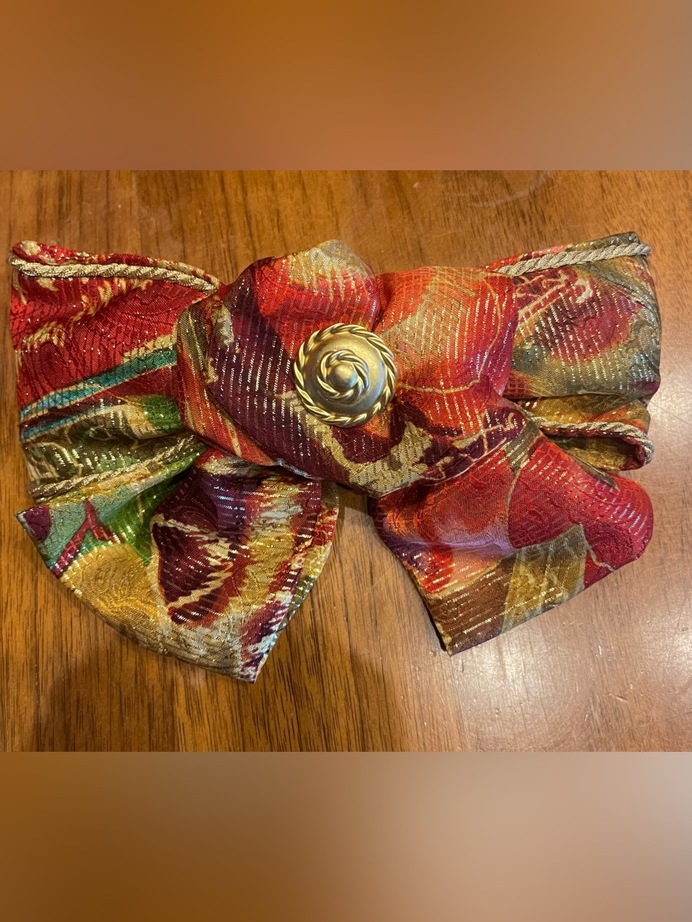 Festive Multicolor Bow Hair Clip with Gold Accent